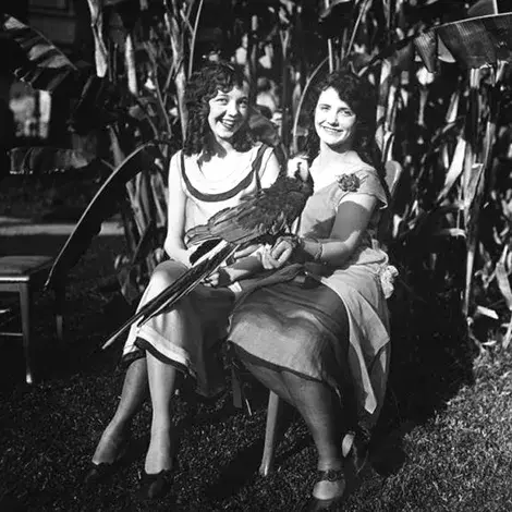 2 women with a parrot