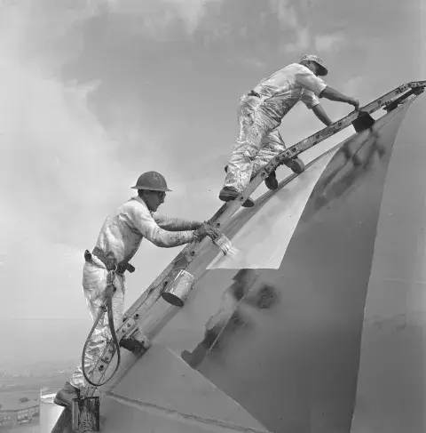 Showing workers painting Jack ca. 1960. Los Angeles Harbor Department. 