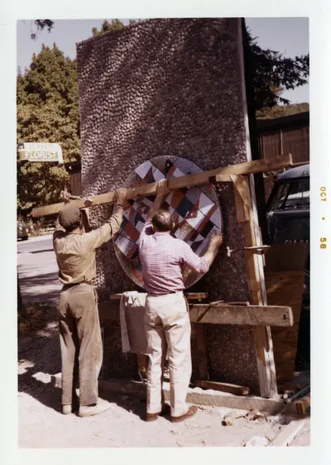 crew putting togehter mural