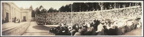 Panorama image showing a standing room only crowd