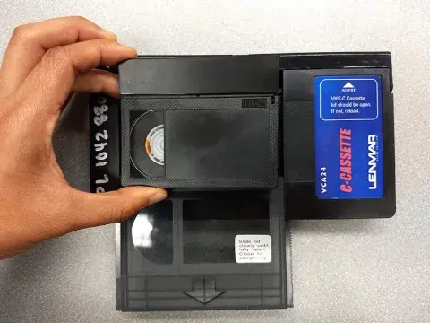 Photo of VHS-C sliding into adapter