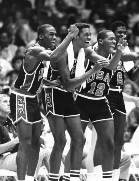 Basketball players cheering