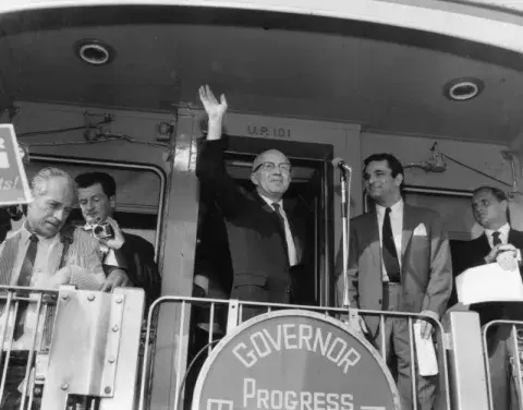 People campaigning on back of train 