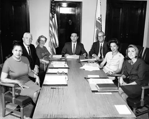 1967 Board of Library Commissioners sit around a table 