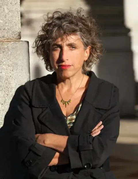 Color headshot of Andrea Bernstein