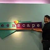 Jorge Ochoa in front of the Teen'Scape sign
