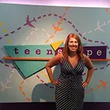 Wende Crowley in front of the teen'scape sign