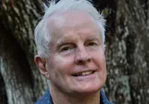 poet David Kirby in front of a tree