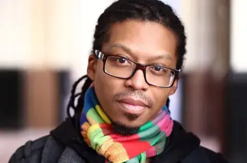 Nathan McClain in a colorful scarf