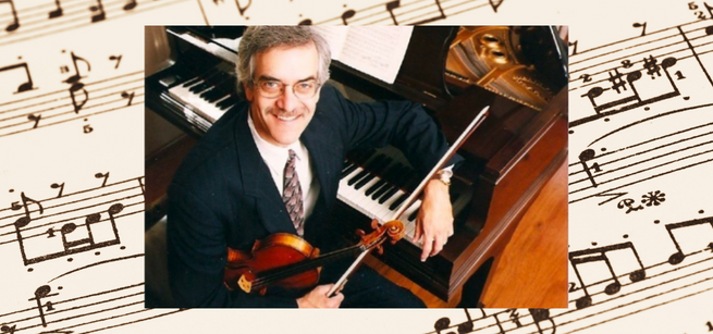 Violinist Paul Stein, sitting at a piano and holding a violin