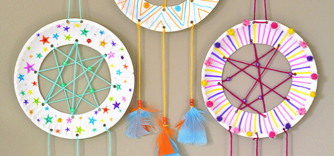 multi-colored paper plate dream catchers with hanging feathers