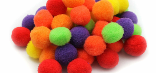 Pile of colorful pom pom craft material