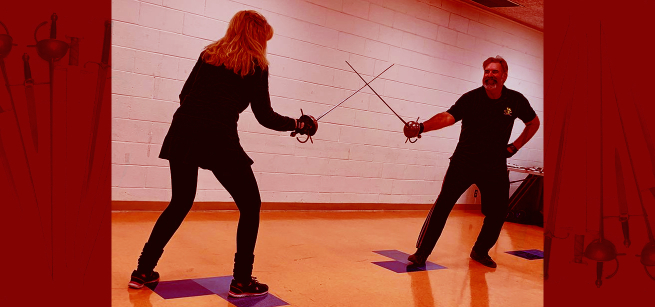 Two Game On Stunt Team members holding swords.