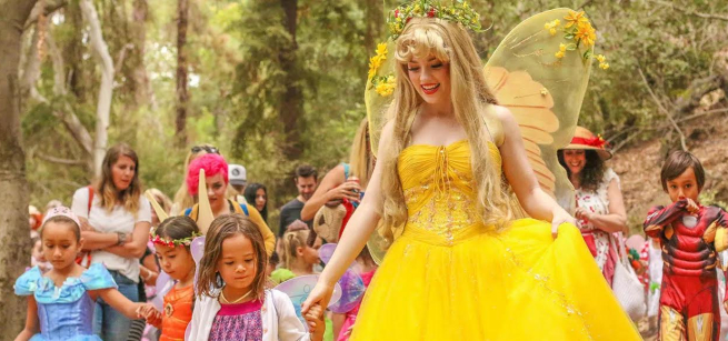 a fairy guides children through a forest