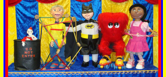 Image of five puppets on a puppet stage.