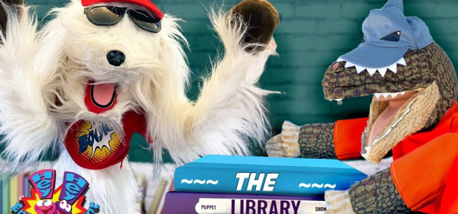 Davey the dog puppet and the Library Bandit puppet are tussling over stolen library books!