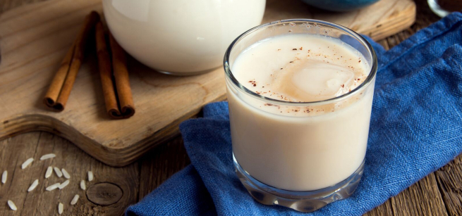 glass of horchata beverage with ice