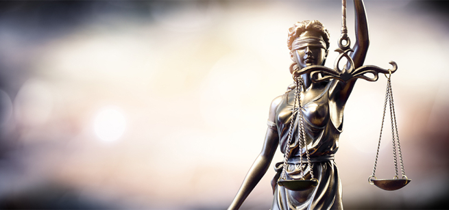 Blindfolded Lady Justice with arm extended, holding a balance scale