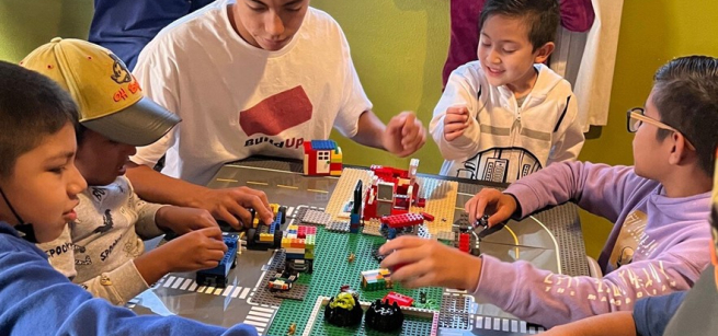 Children building with LEGOs