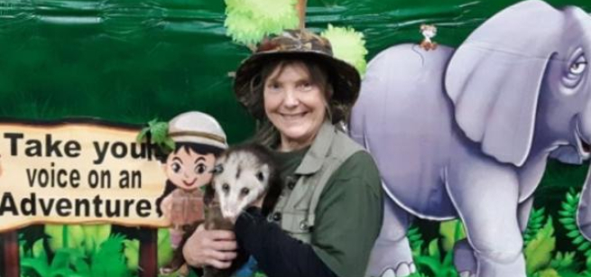 wildlife presenter holding an animal
