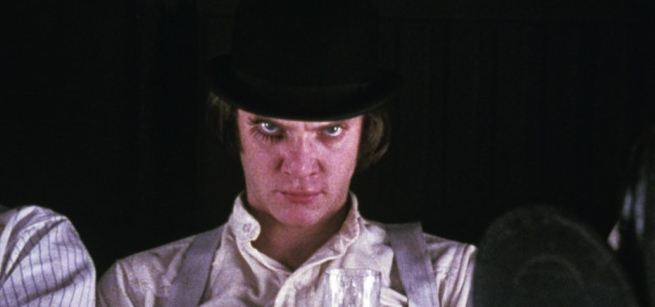 man with in white shirt wearing a bowlers hat