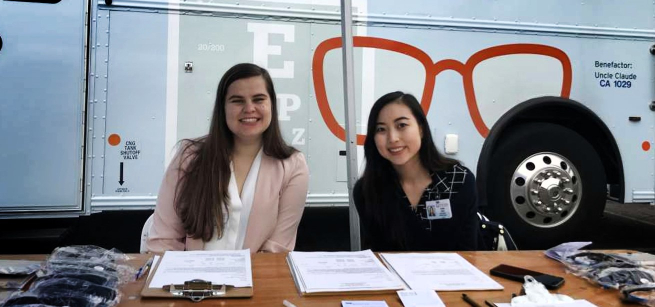 eye clinic staff in front of mobile clinic