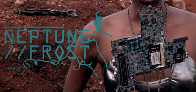 A woman is holding a circuit board standing in an ambiguous landscape littered with discarded electronics.