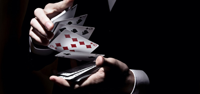 playing cards shuffled in hands