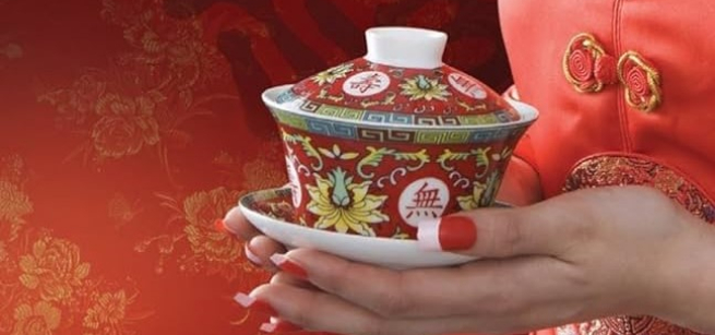 hands holding teacup