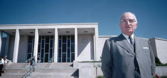 Harry S. Truman standing in front of the Truman Library.