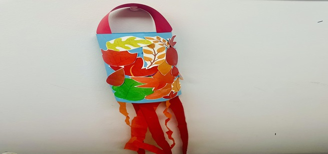A fall windsock craft with leaves 