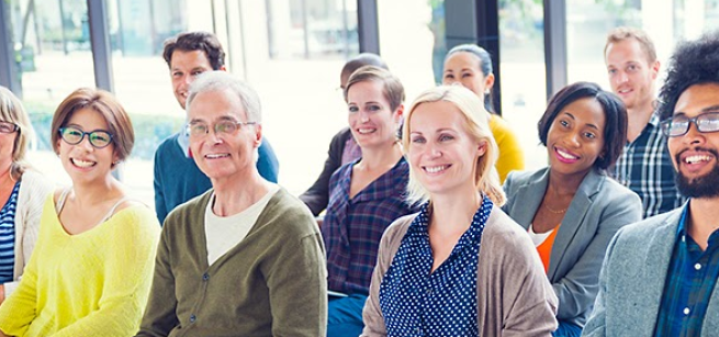 Rows of people in chairs.