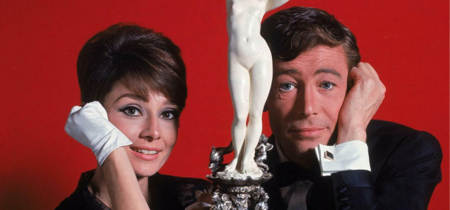 Audrey Hepburn and Peter O'Toole are with the sculpture they stole