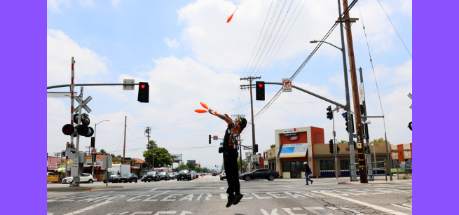 Teaching Artist Diego de los Andes, juggling on the street