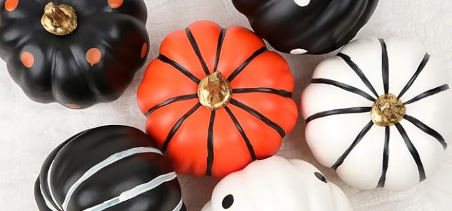 small pumpkins painted colors and decorated 