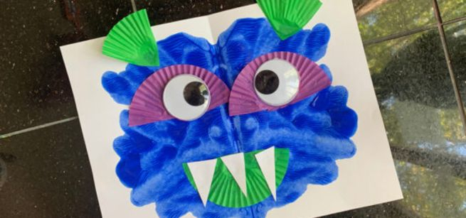 A painting of a blue goofy monster. 