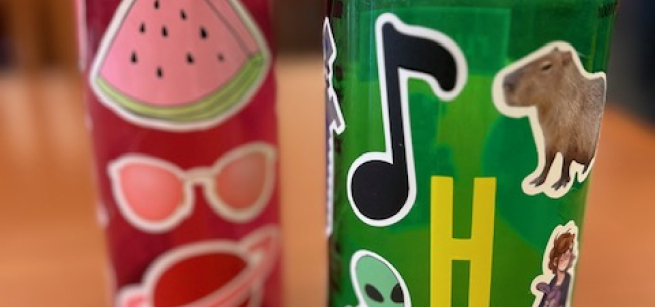 Image of two water bottles decorated with stickers