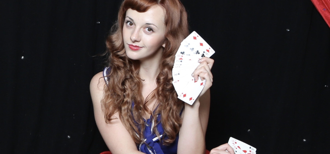 Picture of Magical Katrina holding a deck of cards.