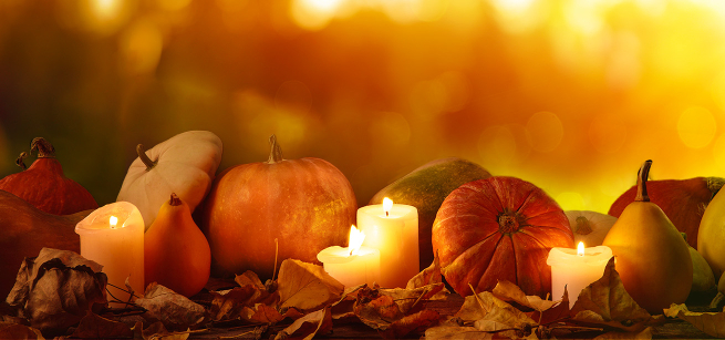 Pumpkins, candles and fall leaves 
