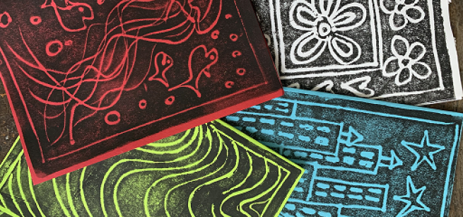 4 completed block print designs: red jellyfish and fish, white butterflies and flowers, yellow waves, and blue skyscrapers