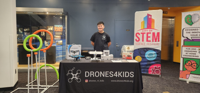 Teen with drones on a table 