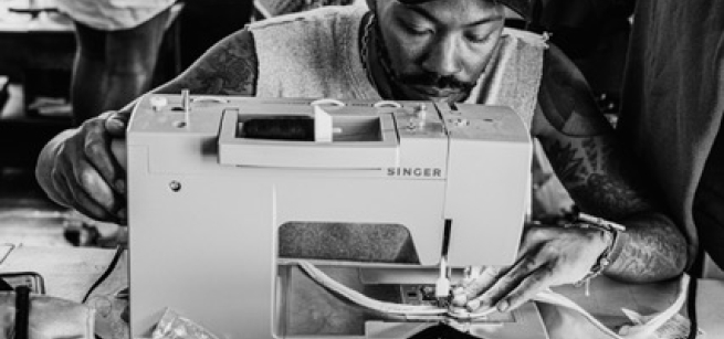 Scott Williams using a sewing machine