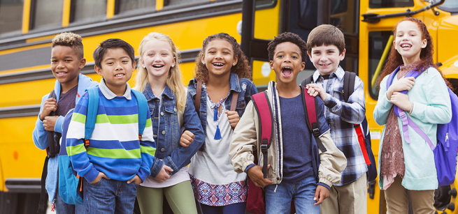 kids in front of a school bus