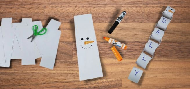 A paper chain snowman with the name Sally written on it. 