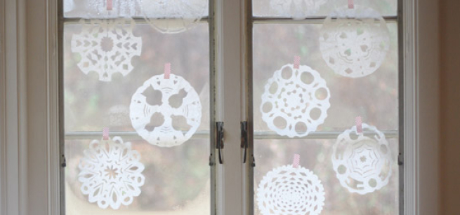coffee filter snowflakes on a window
