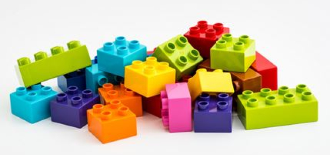 A pile of about 20 different colored LEGO blocks