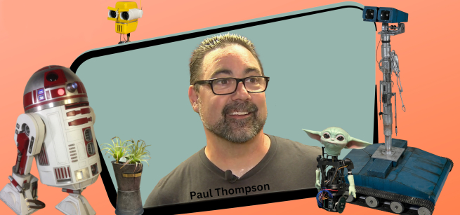 paul thompson standing beside robot animatronics