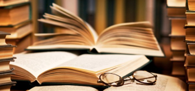 open books and a pair of eyeglasses