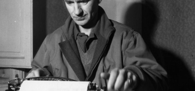 black and white image of ernie on typewriter