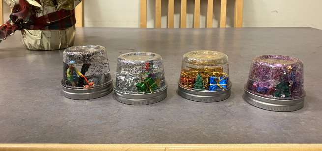 Four home made snow globes